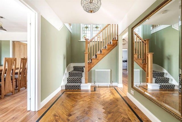 The elegant staircase leads up to a series of bedrooms.