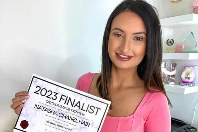 Natasha with her finalist certificate 