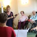 Soprano Jacquelyn Parker at the Holy Cross Care Home. Photographer: Sam Stephenson