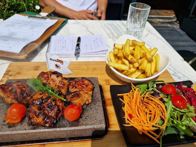 An array of dishes is on offer at ONYX, including a seasoned and charcoal grilled lamb steak – served on a 440 degree rock where you can cook the meat to your own preference, with salad, chips and bulgar
