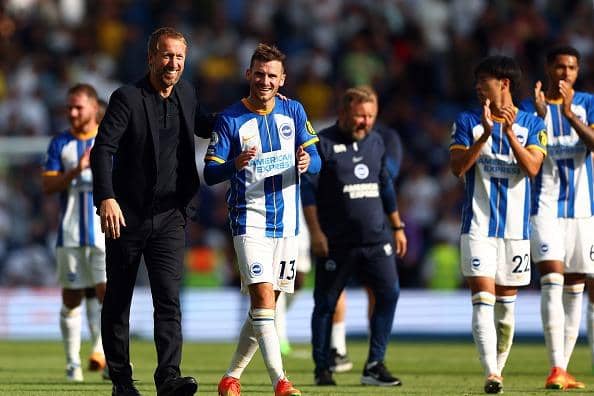 Brighton and Hove Albion head coach Graham Potter congratulates his midfielder Pascal Gross after their Premier League win against Leeds United