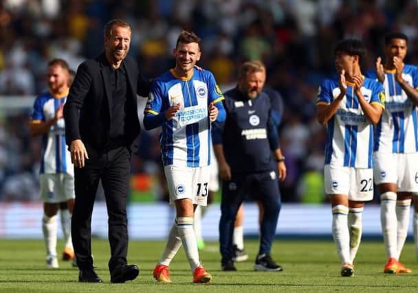 Brighton and Hove Albion head coach Graham Potter congratulates his midfielder Pascal Gross after their Premier League win against Leeds United