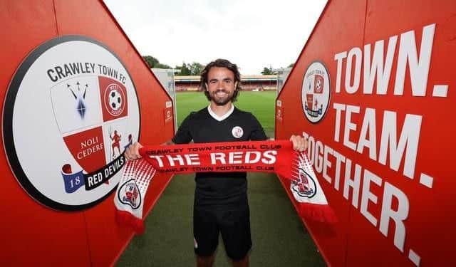 Dominic Telford signs for Crawley Town Football Club at the Broadfield Stadium in Crawley. Credit: James Boardman/Alamy Live News