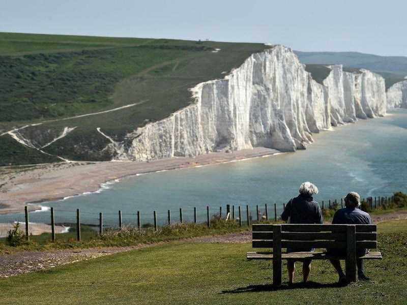 The Seven Sisters cliffs run between the mouth of the River Cuckmere near Seaford, and the chalk headland of Beachy Head outside of Eastbourne. The dips or swales that separate each of the seven crests from the next are the remnants of dry valleys in the chalk South Downs which are being gradually eroded by the sea.