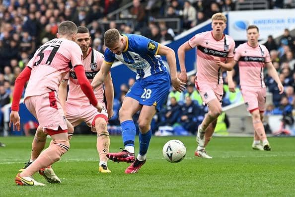 Brighton striker Evan Ferguson scores against Grimsby Town in the FA Cup
