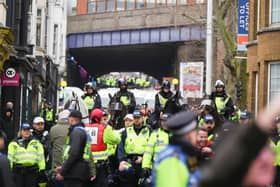 Photos taken outside Brighton railway station – and in neighbouring roads – show a large number of police officers, dealing with rowdy fans before kick-off