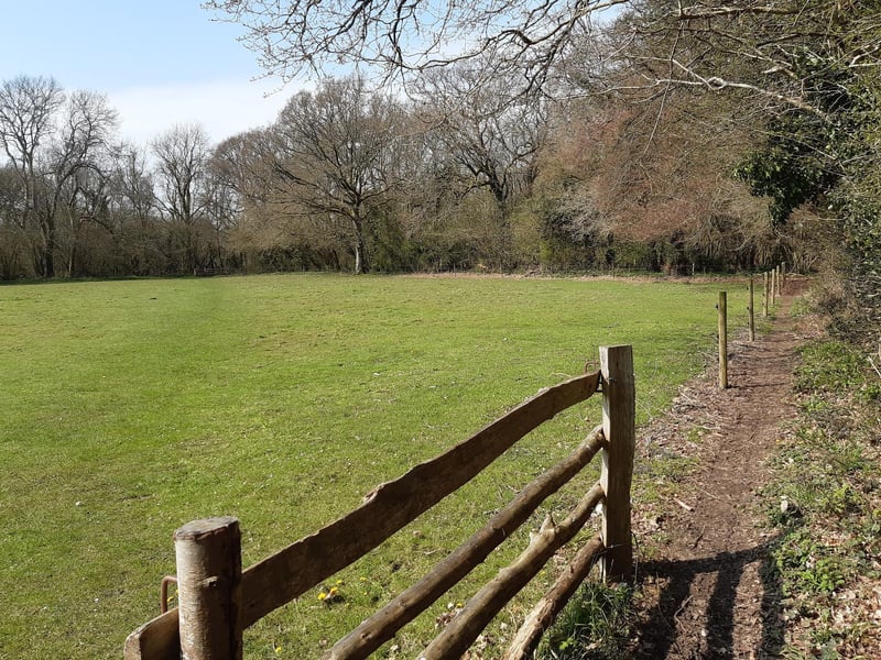 You could just turn left at the first stile and follow the path around the field to the stile on the other side (this view is looking back down the field)