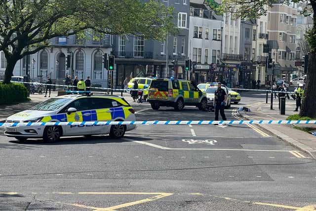 Police cordoned off St James's Street after the Brighton man was hit by a bus. He remains in hospital with life-threatening injuries. Photo: Eddie Mitchell