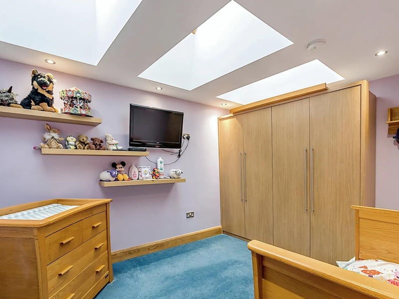 Another of the property's five bedrooms