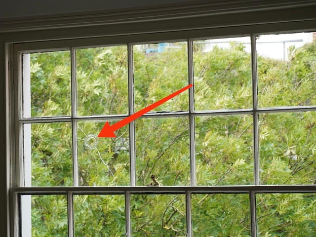 The hole caused by the missile (marked)