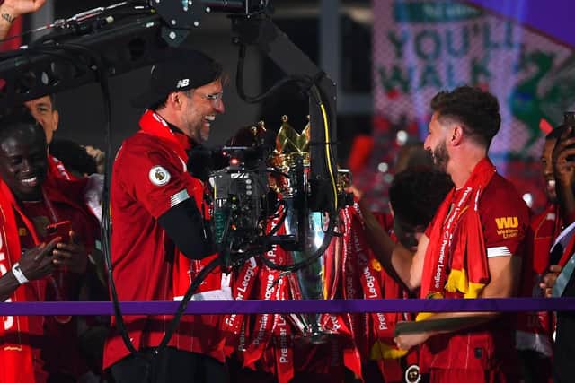 Jurgen Klopp, Manager of Liverpool and Adam Lallana. (Photo by Laurence Griffiths/Getty Images)