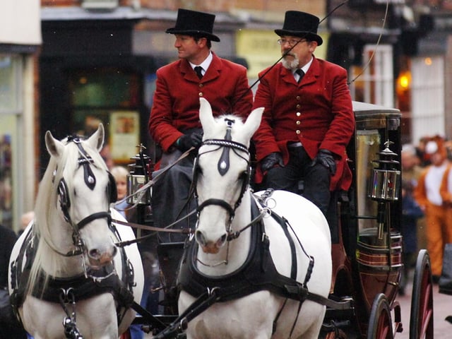 Arriving by horse and carriage for the 2008 parade, the newly-crowned Snow Queen proceeds along North Street