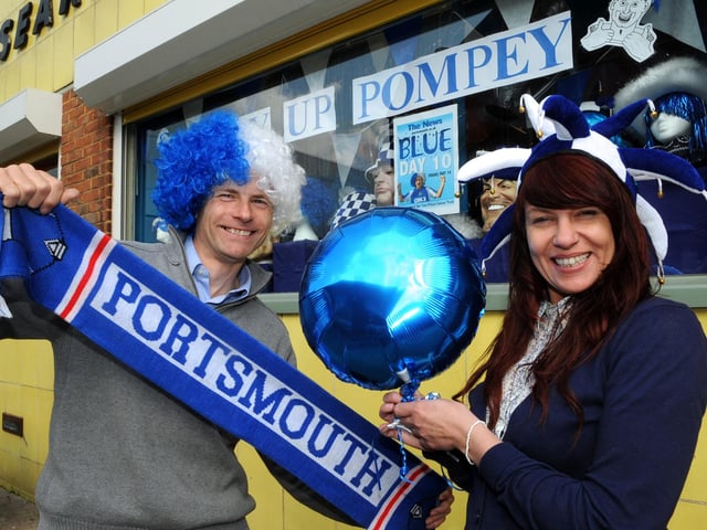Steve Searle and Sarah Wellham hold a Portsmouth scarf outside U-Need-Us in May 2010 ahead of the FA Cup final which Pompey played in. Picture: Ian Hargreaves (101530-1)