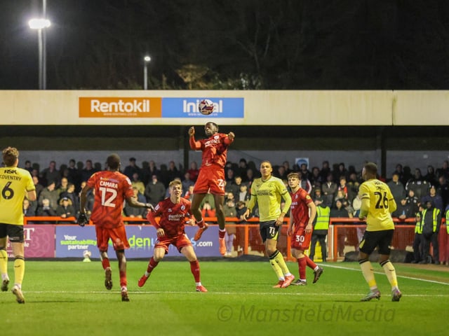 Ade Adeyemo jumps highest against Charlton at the Broadfield Stadium