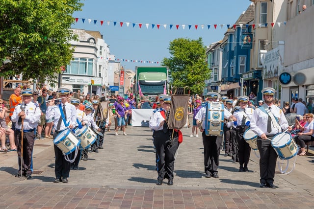 The parade heads through town. Photo: Neil Cooper