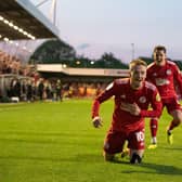 Liam Kelly chases goal scorer Ronan Darcy after scoring Crawley Town's third | Picture: Eva Gilbert