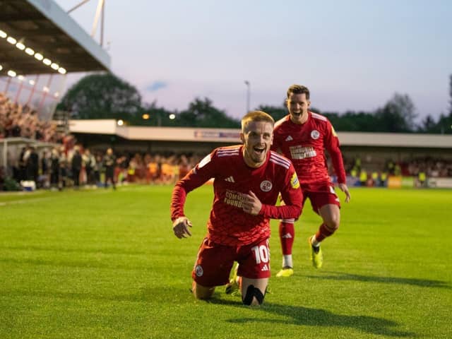 Liam Kelly chases goal scorer Ronan Darcy after scoring Crawley Town's third | Picture: Eva Gilbert