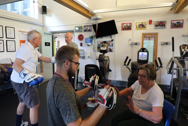 Lu trains in the charity's gym to help her re-gain mobility