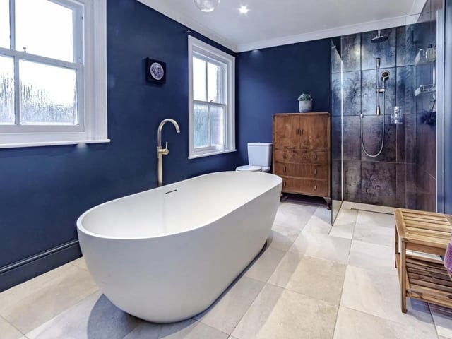 A luxury bathroom is on the first floor