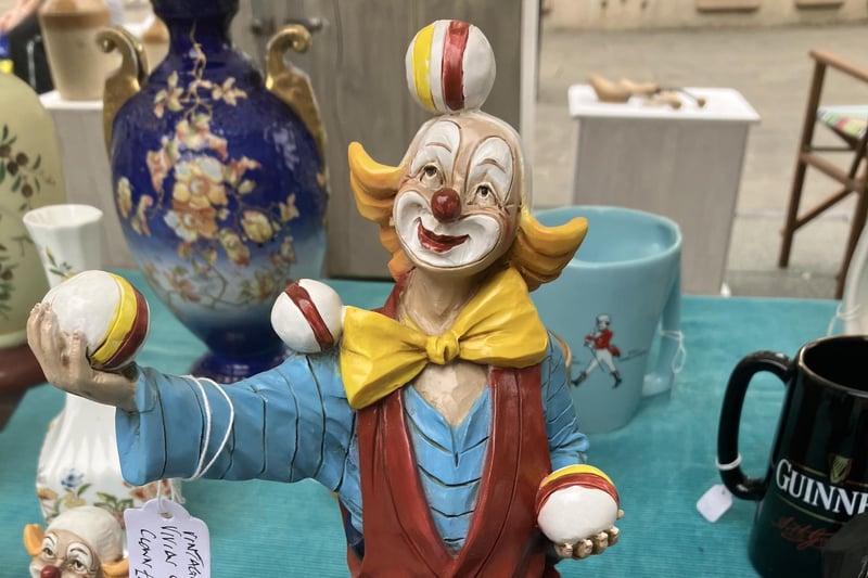 A jolly juggler among the collectibles.