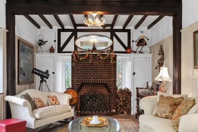 Lounge showing fireplace and beams