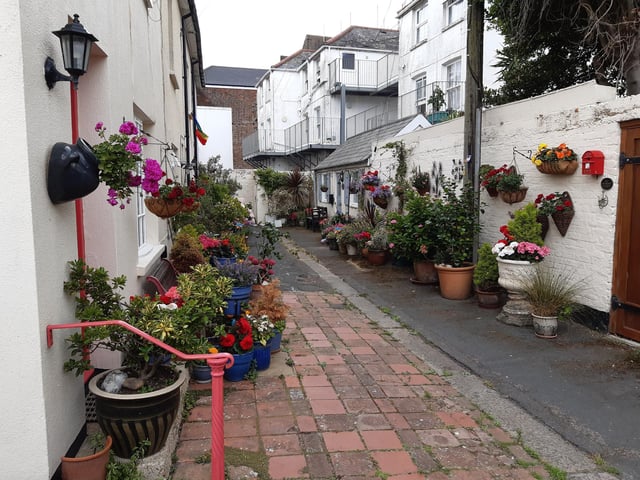 Floral splendour at Brunswick Cottages, a tiny courtyard of four fishermen's houses off the twitten that marks the historic boundary between Worthing and Heene
