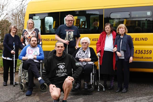 Hastings Runners' Kevin Blowers with the charity he is supporting in the London Marathon