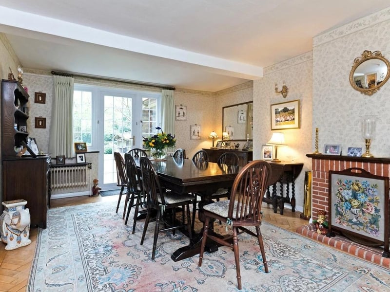 The beautiful formal dining room has a glazed door leading out to the large terrace