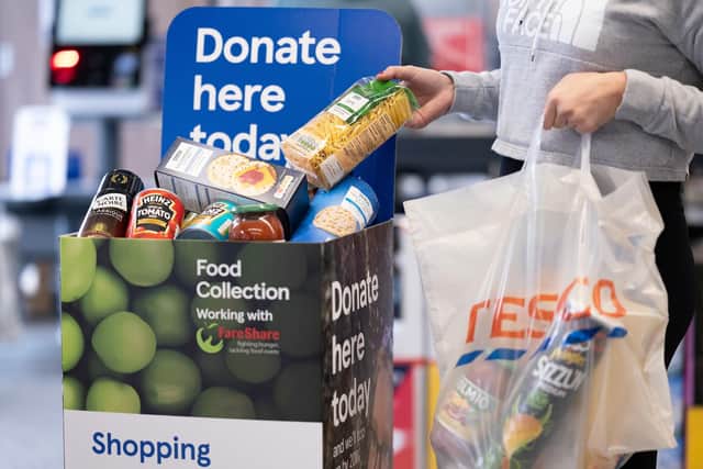 Tesco has launched an initiative for customers to lend a helping hand to food banks and charities. Picture by Matthew Horwood.