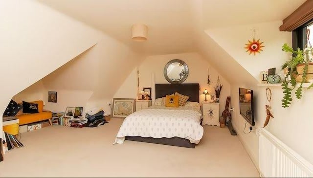 Stairs lead to the second floor where there is a spacious bedroom with en-suite shower room