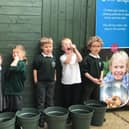 Pupils from St Mary’s C of E Primary School enjoy planting up their chitted potatoes at Squire’s Washington.