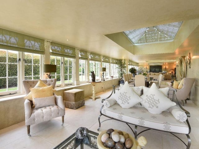 There is a spacious drawing room, family room and orangery