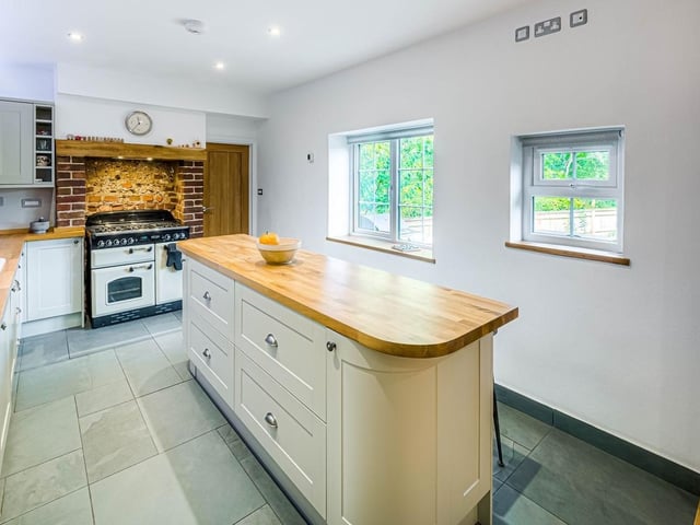 This stunning flint-and-brick detached house dates to the 1800s and used to be a pub. It was converted in about 2016 and boasts four bedrooms, three reception rooms and mature, secluded gardens.