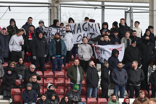 Crawley Town fans protest against they owners of the Club during the Sky Bet League Two between Northampton Town and Crawley Town at Sixfields on March 04, 2023 in Northampton, England. (Photo by Pete Norton/Getty Images)