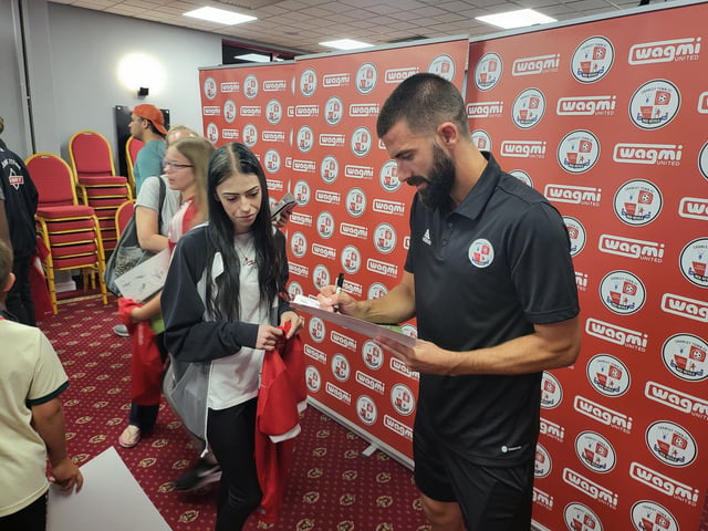 George Francomb signs a picture
