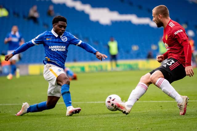 BRIGHTON, ENGLAND - SEPTEMBER 26: Luke Shaw of Manchester United in action with Tariq Lamptey of Brighton and Hove Albion during the Premier League match between Brighton & Hove Albion and Manchester United at American Express Community Stadium on September 26, 2020 in Brighton, England.