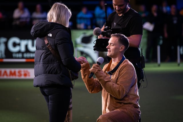 Alasdair Newport, from Pyecombe, emerged dressed in a dog costume in front of a sold-out crowd at Crufts before getting down on one knee for Stacey Irwin-Burns.