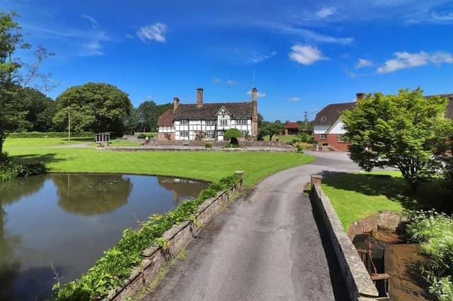 The farmhouse is set well back from the road with a picturesque approach from East Mascalls Lane via a tree-lined private drive
