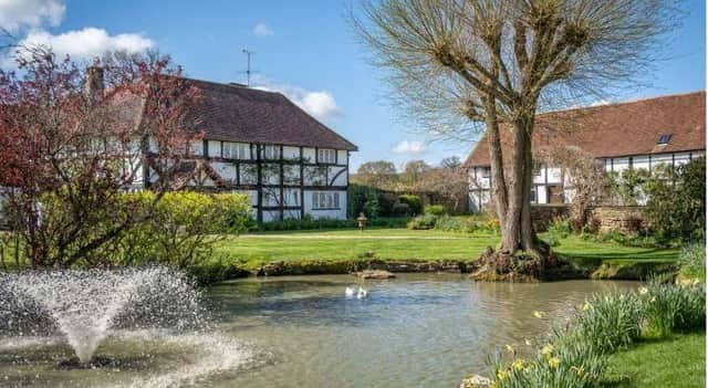 This beautiful Grade II listed 15th century 12-bedroom property is set in an 88-acre estate at Slinfold, near Horsham.