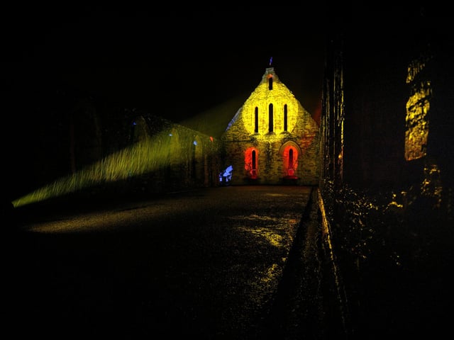 Illuminated Battle Abbey on December 7 2023. Photo by Jim Holden and supplied by English Heritage.
