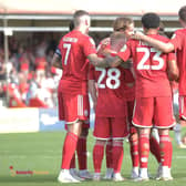 The players get together after a goal against Newport County | Picture: Natalie Mayhew/Butterflyfootie