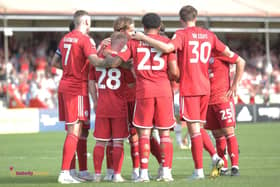 The players get together after a goal against Newport County | Picture: Natalie Mayhew/Butterflyfootie