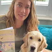 Ash Hunter with her new book and her dog (contributed pic)