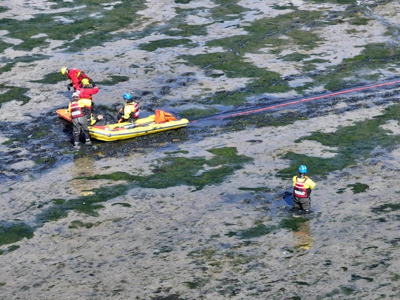 Both agencies worked together to rescue casualties from mud.