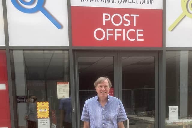 Councillor Shuttleworth by Langney Post Office in Eastbourne
