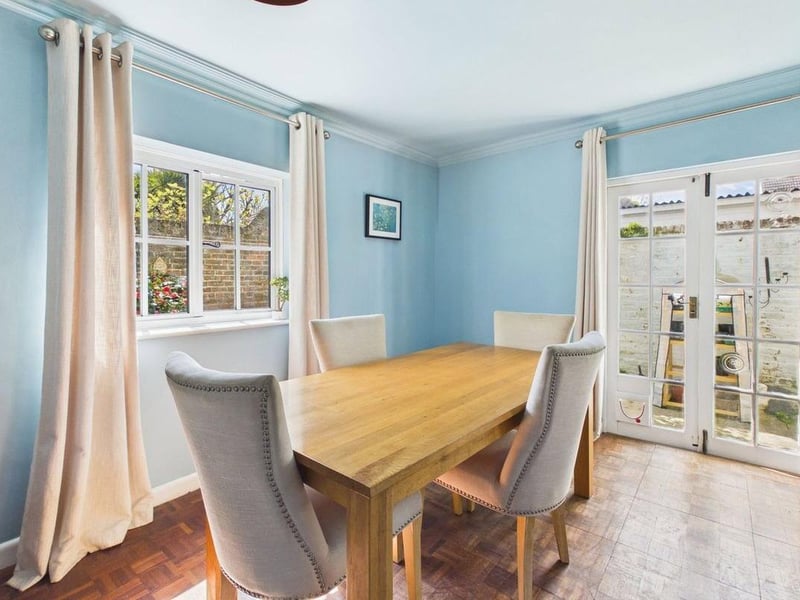 The kitchen flows through to a dual-aspect breakfast room with French doors to the garden