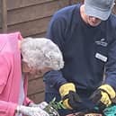 Hazel Lodge's gardener Richard being shown how it's done by resident Sylvia.