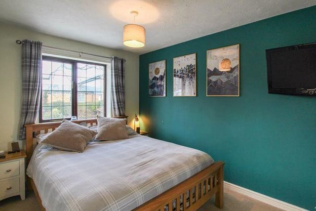 We've moved upstairs now, and into the largest of the three bedrooms. Tastefully decorated, it is a lovely room that faces the back of the property.