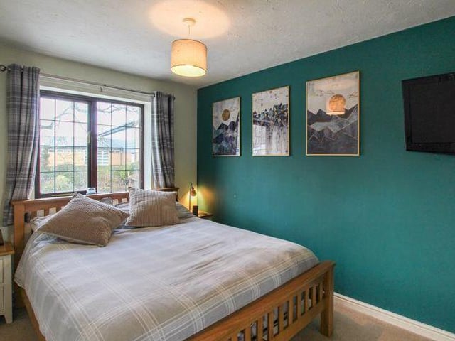 We've moved upstairs now, and into the largest of the three bedrooms. Tastefully decorated, it is a lovely room that faces the back of the property.