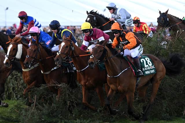Sam Waley-Cohen and Noble Yeats (28) clear the Chair on the way to winning the Randox Grand National from Mark Walsh riding Any Second Now (L) at Aintree in 2022 (Photo by Shaun Botterill/Getty Images)